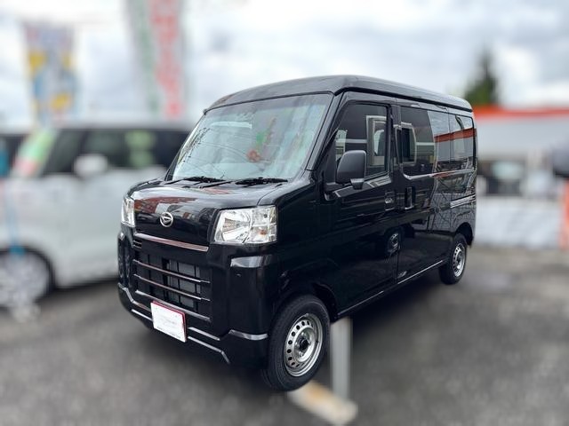Daihatsu Hijet Cargo Deluxe model in black metallic paint -- 4x4 Japanese mini truck with CVT transmission
