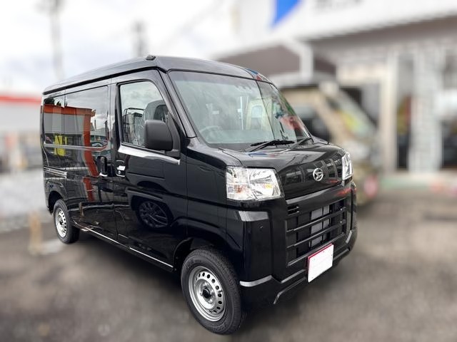 Daihatsu Hijet Cargo Deluxe model in black metallic paint -- 4x4 Japanese mini truck with CVT transmission