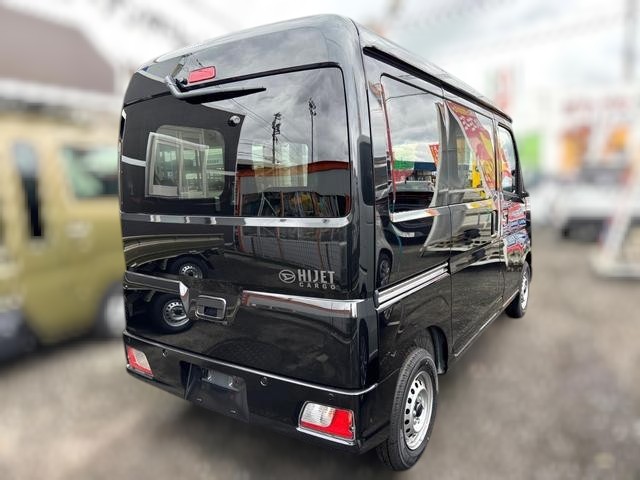 Daihatsu Hijet Cargo Deluxe model in black metallic paint -- 4x4 Japanese mini truck with CVT transmission