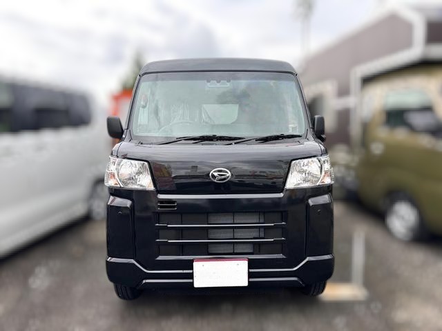 Daihatsu Hijet Cargo Deluxe model in black metallic paint -- 4x4 Japanese mini truck with CVT transmission