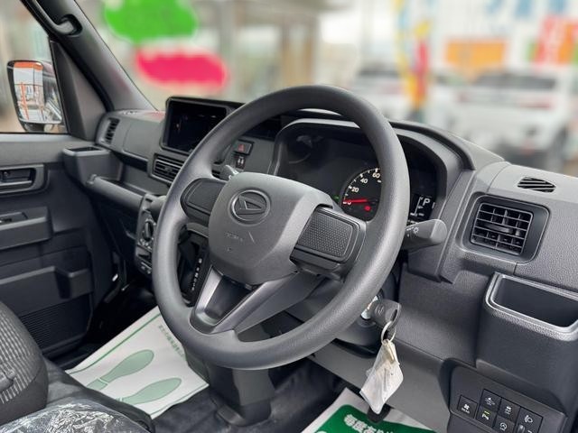 Daihatsu Hijet Cargo Deluxe model in black metallic paint -- 4x4 Japanese mini truck with CVT transmission