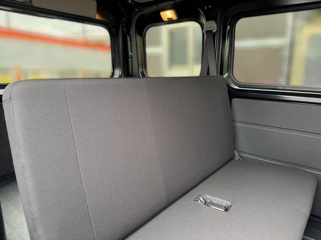 Daihatsu Hijet Cargo Deluxe model in black metallic paint -- 4x4 Japanese mini truck with CVT transmission