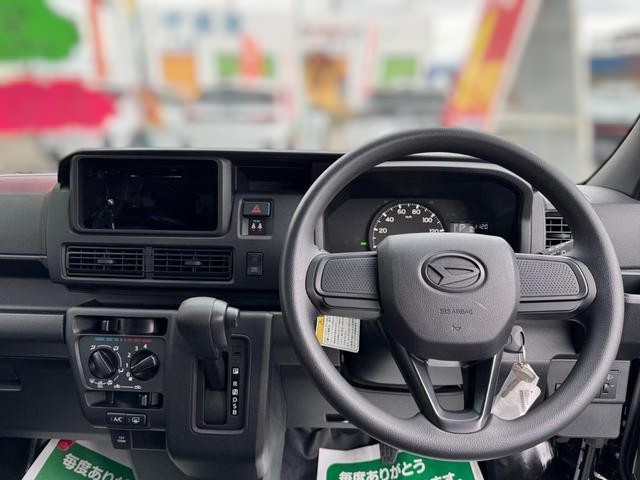 Daihatsu Hijet Cargo Deluxe model in black metallic paint -- 4x4 Japanese mini truck with CVT transmission