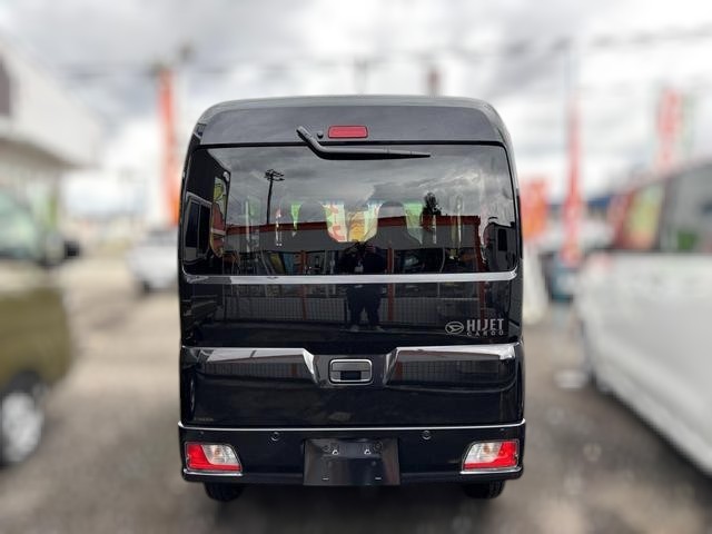 Daihatsu Hijet Cargo Deluxe model in black metallic paint -- 4x4 Japanese mini truck with CVT transmission