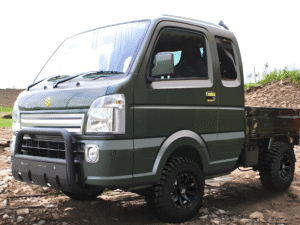 Suzuki Super Carry in green / gray off-road on rough ground