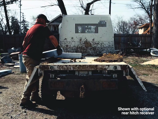 Daihatsu Hijet HD Dump shown from rear with stone being loaded over the dropped sides