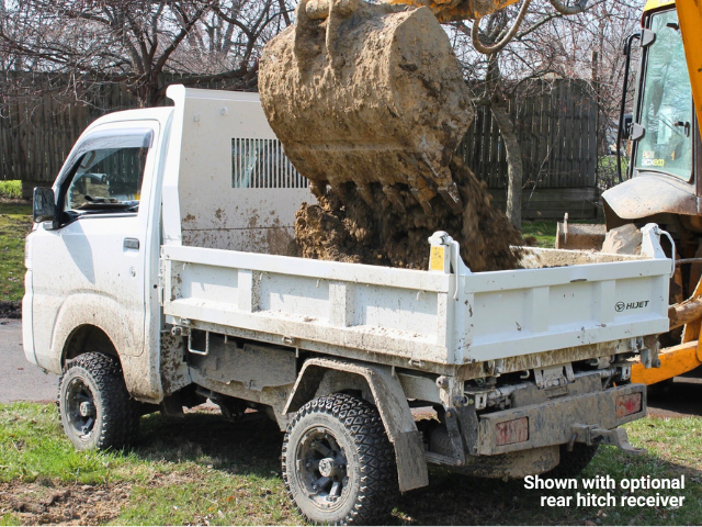 Daihatsu Hijet HD Dump shown from left rear with soil being loaded into the bed