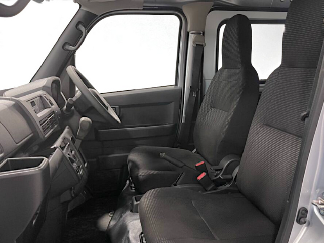 Front seats from the passenger side in a CVT Daihatsu Hijet Cargo 4x4 Japanese mini truck