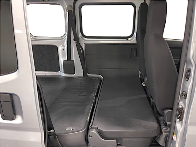 Rear bench seat folded flat in a Daihatsu Hijet Cargo 4x4 Japanese mini truck