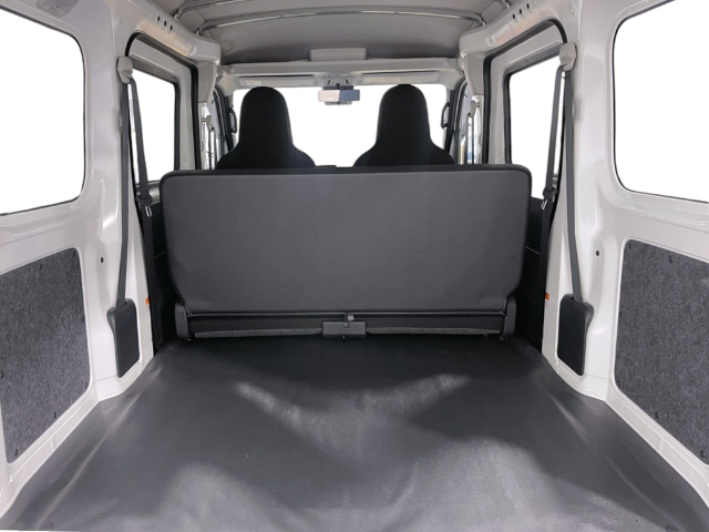 Rear cargo area with flat floor and rear seat up in the Daihatsu Hijet Cargo 4x4 Japanese mini truck