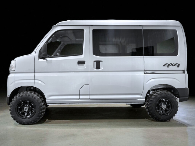 Left side view of a silver Daihatsu Hijet Cargo 4x4 Japanese mini truck