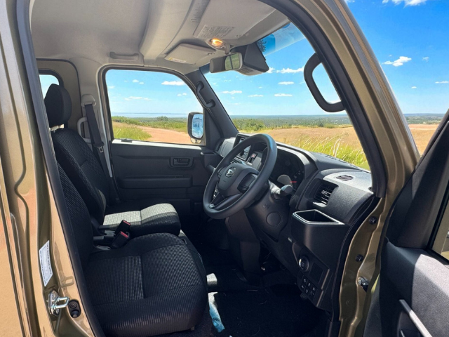 Daihatsu Hijet Deckvan in green front seats