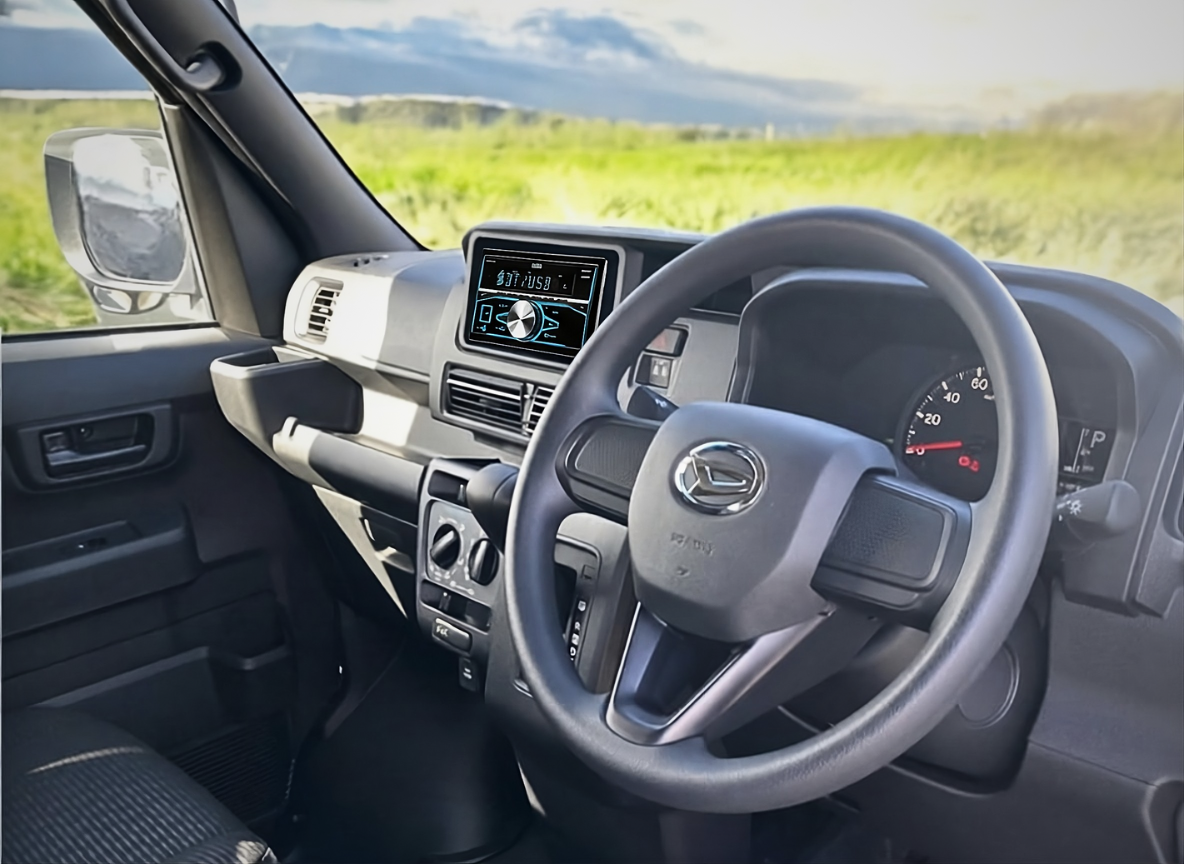 Interior of Daihatsu Hijet Deckvan from driver's side.