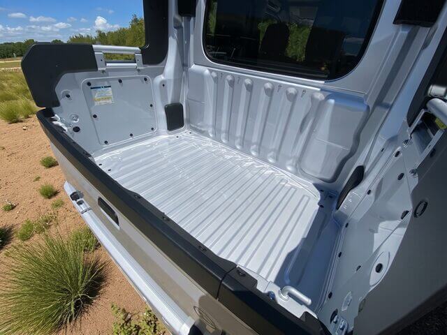 Daihatsu Hijet Deckvan in silver 4x4 off-road Japanese mini truck showing interior of deep rear load bed