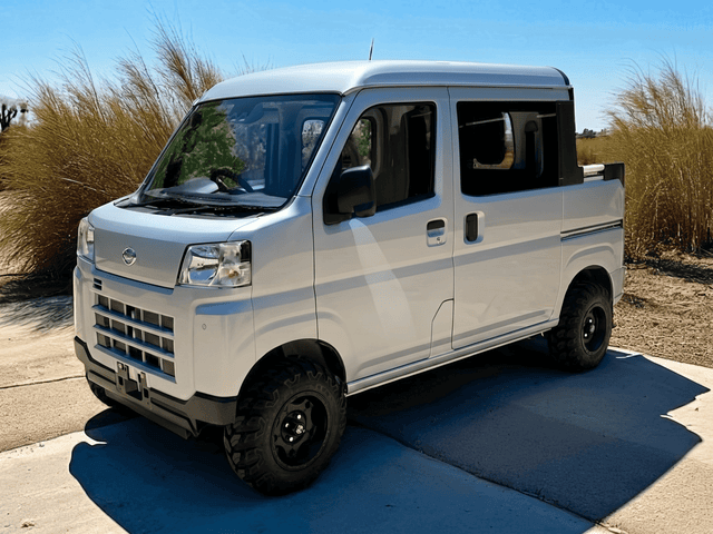 Daihatsu Hijet Deckvan in silver 4x4 Japanese mini truck from left front