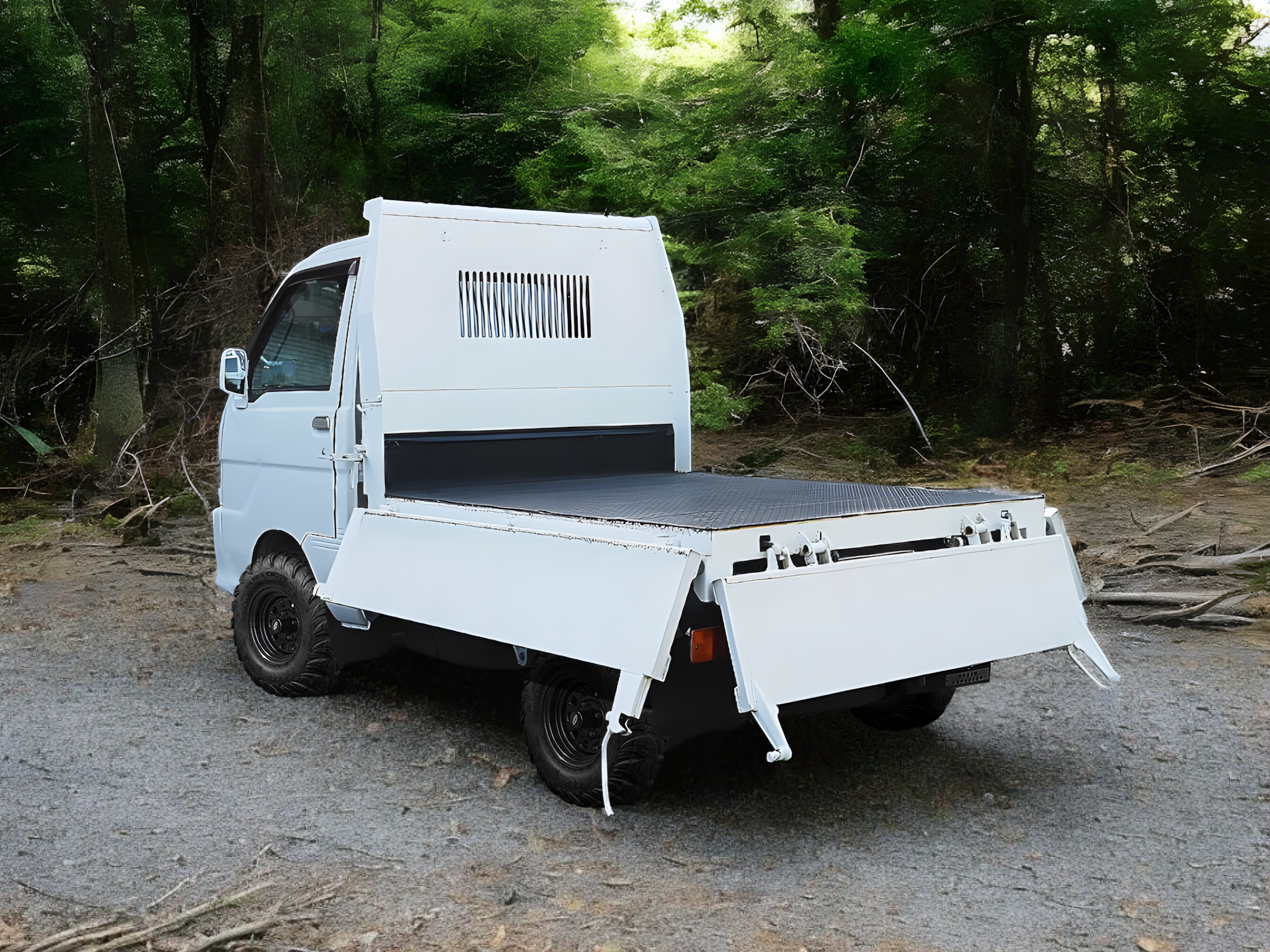 Daihatsu Hijet Dump Japanese mini truck showing load bed with 3 sides folded down