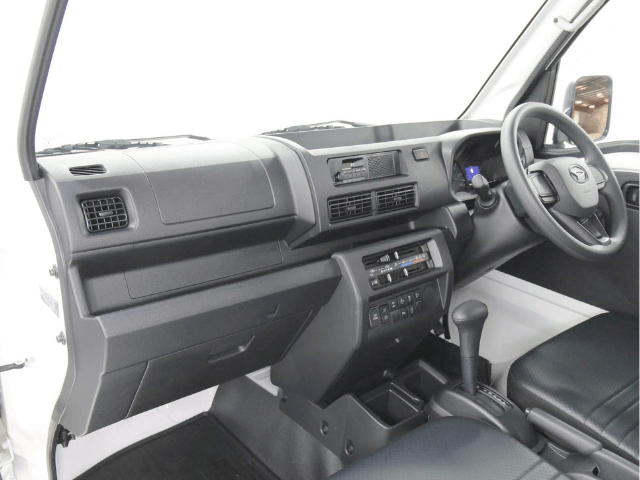 Studio shot of Daihatsu Hijet HD Dump automatic model interior from passenger side