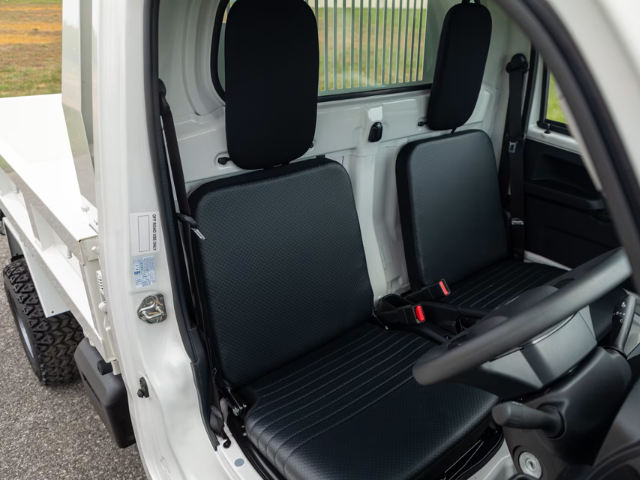 Daihatsu Hijet HD Dump in field showing seats and interior