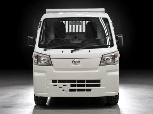 Studio shot of Daihatsu Hijet HD Dump from front with bed down