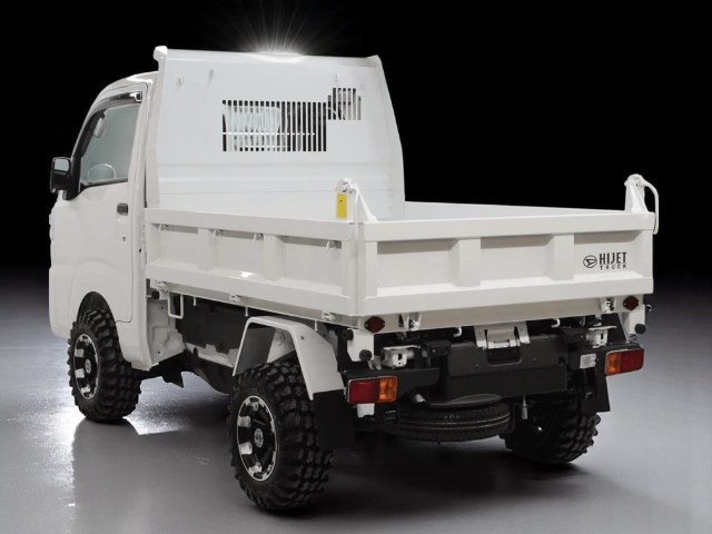 Studio shot of Daihatsu Hijet HD Dump from left rear with bed down