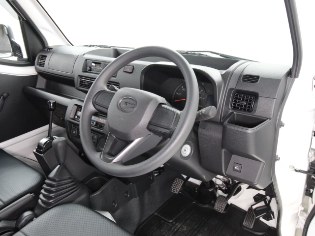 Studio shot of Daihatsu Hijet HD Dump manual PTO model interior
