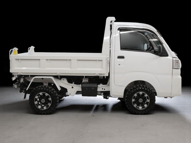Studio shot of Daihatsu Hijet HD Dump from right side with bed down