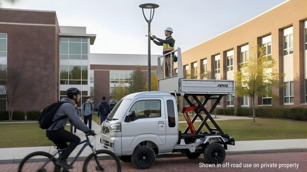 Daihatsu Hijet Jumbo Lift Dump 4x4 Japanese mini truck shown working on a college campus on private property