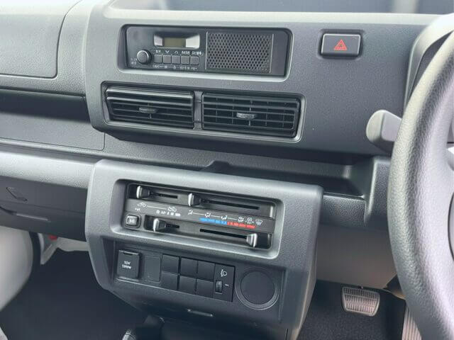 Daihatsu Hijet Panel Van 4x4 Japanese mini truck interior center console showing AC and heat controls
