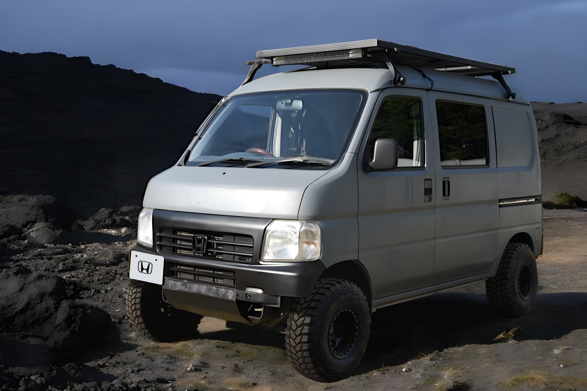 Honda Acty van off-road on a lava field