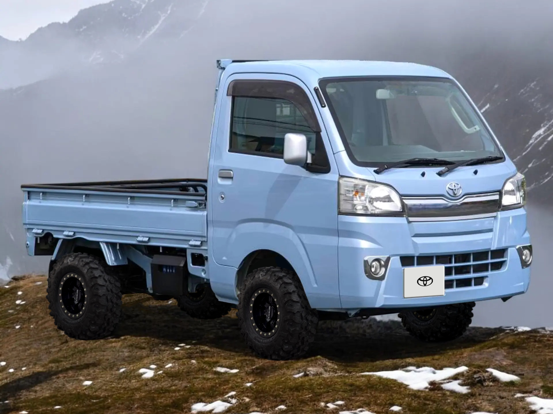Toyota Pixis Japanese mini truck in mist blue metallic paint on a mountain overlook